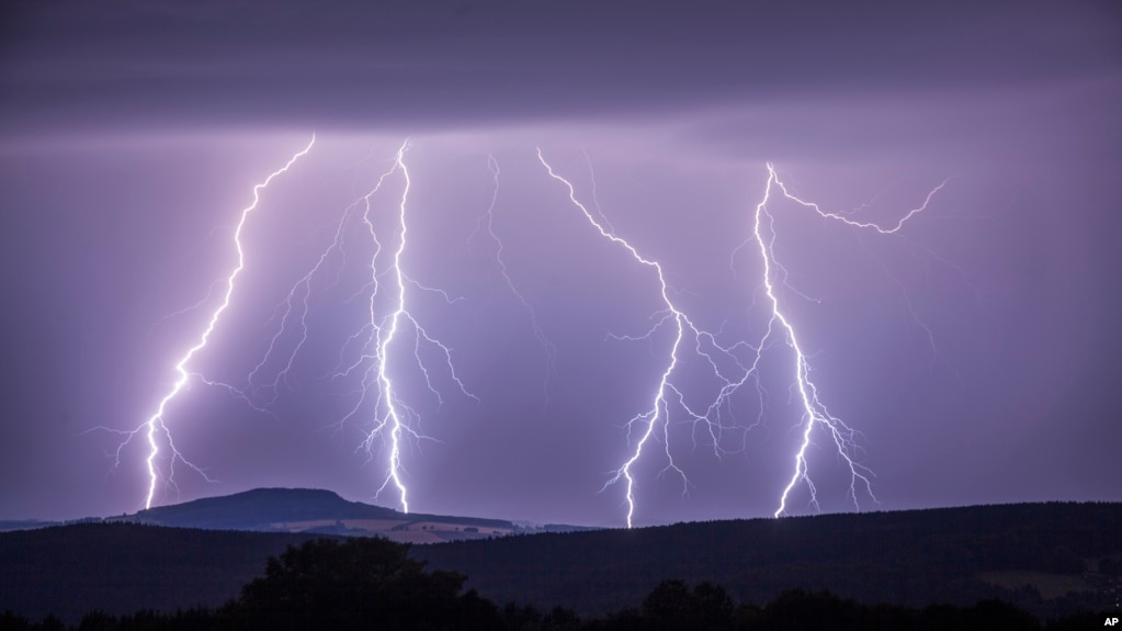 In this photo taken Aug. 9, 2017 a strike of lightning lights up the sky over Annaberg-Buchholzer, southeastern Germany. (Bernd Maerz/dpa via AP)