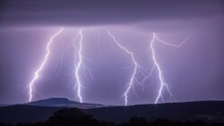 In this photo taken Wednesday, Aug. 9, 2017 a strike of lightning illuminates the sky over Annaberg-Buchholzer, southeastern Germany. (Bernd Maerz/dpa via AP)