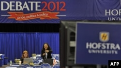 Media sets up in Spin Alley ahead of the second debate between Republican presidential candidate Mitt Romney and US President Barack Obama, to be held at the David Mack Center at Hofstra University in Hempstead, New York, October 15, 2012. 