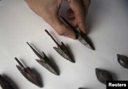 Arrowheads, uncovered by Israeli archaeologists at a site that they say contains the remnants of an ancient Greek fortress, are displayed in Jerusalem, Nov. 3, 2015.