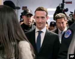 Facebook CEO Mark Zuckerberg arrives on Capitol Hill in Washington, April 9, 2018, to meet with Sen. Dianne Feinstein, D-Calif., the ranking member of the Senate Judiciary Committee.