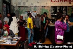 Attendees mingling at the first Black Iftar event, held in Chicago and hosted by Samira Abderahman.