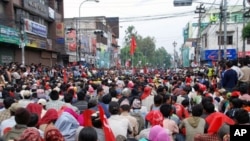 Thousands of Maoist supporters rally in what is normally one of Kathmandu's busiest streets near the government center, 05 May 2020