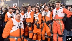 Fans dressed in character wait in the stands at the world premiere of "Star Wars: The Force Awakens" at the TCL Chinese Theatre on Monday, Dec. 14, 2015.