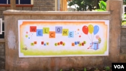 Sign outside the new day care center at Langata Women's Prison in Nairobi, Kenya, January 23, 2013." (VOA/Jill Craig)