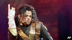 FILE - In this Aug. 25, 1993 file photo, American pop star Michael Jackson performs during his "Dangerous" tour in Bangkok.