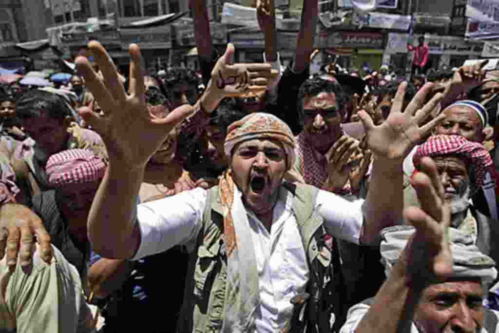 An anti-government protestor, shouts slogans during a demonstration demanding the resignation of Yemeni President Ali Abdullah Saleh, in Sanaa, Yemen, May 12, 2011