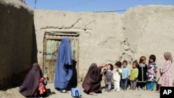 FILE - Afghan children are being vaccinated in an Afghan province.