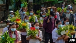 This photo taken and received courtesy of an anonymous source via Facebook on April 13, 2021 shows Thingyan festival flowers and leaves displayed in pots decorated with designs in support of demonstrations by protesters against the military coup in Yangon