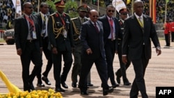 Sudan's President Omar al-Bashir (C) attends the swearing-in ceremony of Uganda's President Yoweri Museveni as newly elected President in Kampala on May 12, 2016.