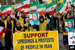 The Anglo-Iranian communities, supporters of Iran's democratic opposition, the National Council of Resistance of Iran (NCRI) and main organised opposition movement PMOI, hold a rally opposite the entrance of 10 Downing Street in London, Jan. 4, 2018.