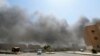 دود ناشی از بمباران هوایی ارتش سوریه روی مواضع پیکارجویان داعش - رقه، ۲۶ مرداد ۱۳۹۳