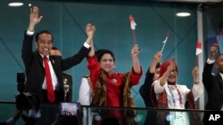 Presiden Joko Widodo dan Ibu Negara di pembukaan Asian Games 2018.