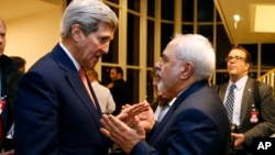 Secretary of State John Kerry talks with Iranian Foreign Minister Mohammad Javad Zarif.