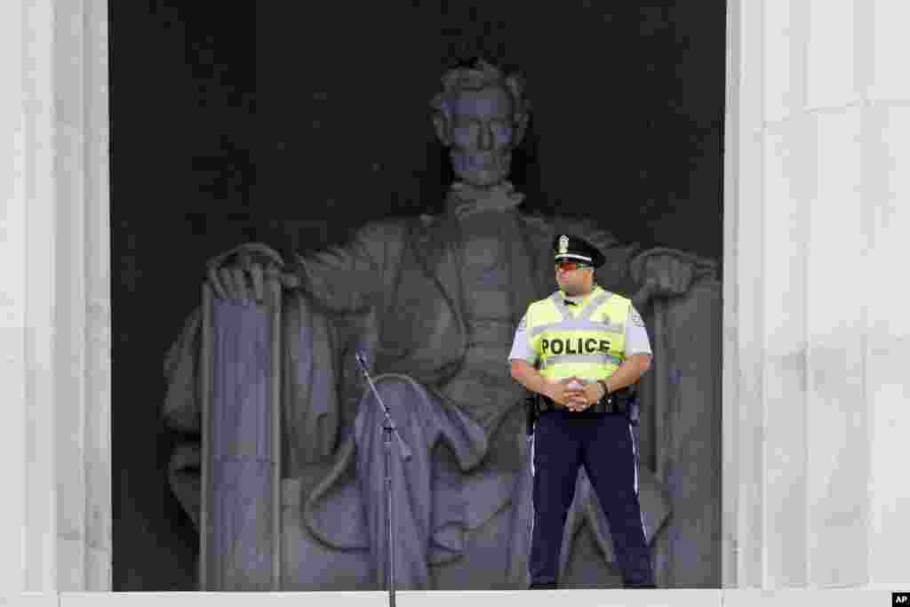 A U.S. Park Police officer stands watch before the start of the 50th Anniversary of the March on Washington where Martin Luther King, Jr., spoke in front of the Lincoln Memorial, August 28, 2013. 