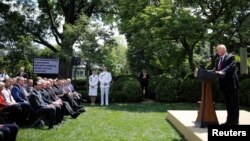 President Donald Trump speaks about his administration's proposals to change U.S. immigration policy as members of his cabinet and others listen in the Rose Garden of the White House in Washington, May 16, 2019. 