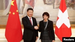 Swiss President Doris Leuthard and China's President Xi Jinping shake hands prior to their talks in Bern, Switzerland, Jan. 16 2017. 