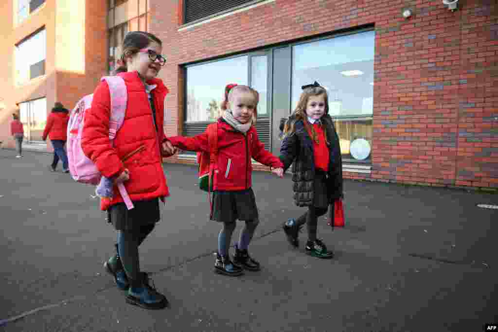 Pupils arrive at Clyde Primary School in Glasgow as schools in Scotland started to reopen to more of the youngest students in an easing of the coronavirus shutdown.