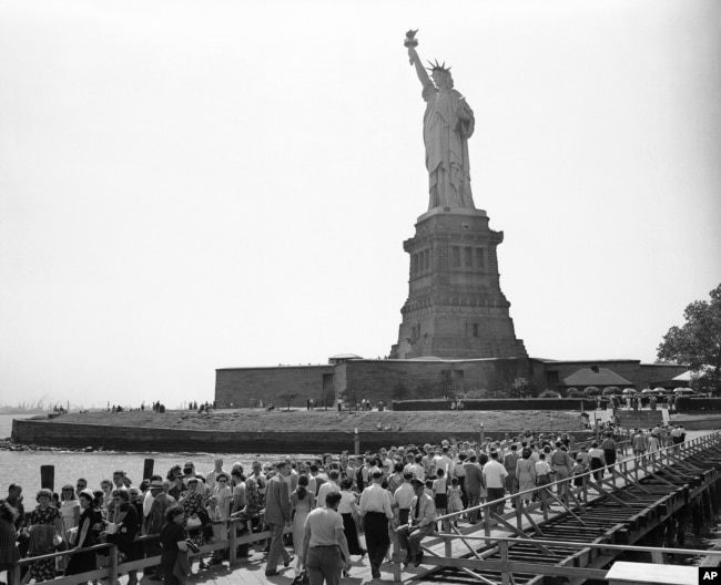 Visitors move toward the base of the Statue of Liberty on Bedloe’s Island in New York’s harbor on July 12, 1948.