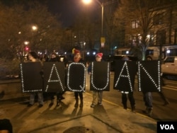 Protesters spell out the name of Laquan McDonald, who was shot in a video recently released by police, Nov. 24, 2015. (C. Presutti/VOA)