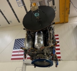 The nearly fully assembled, the 13-foot tall Lucy spacecraft is lifted back to its dolly as the Lockheed Martin team in Denver, Colorado continues production.