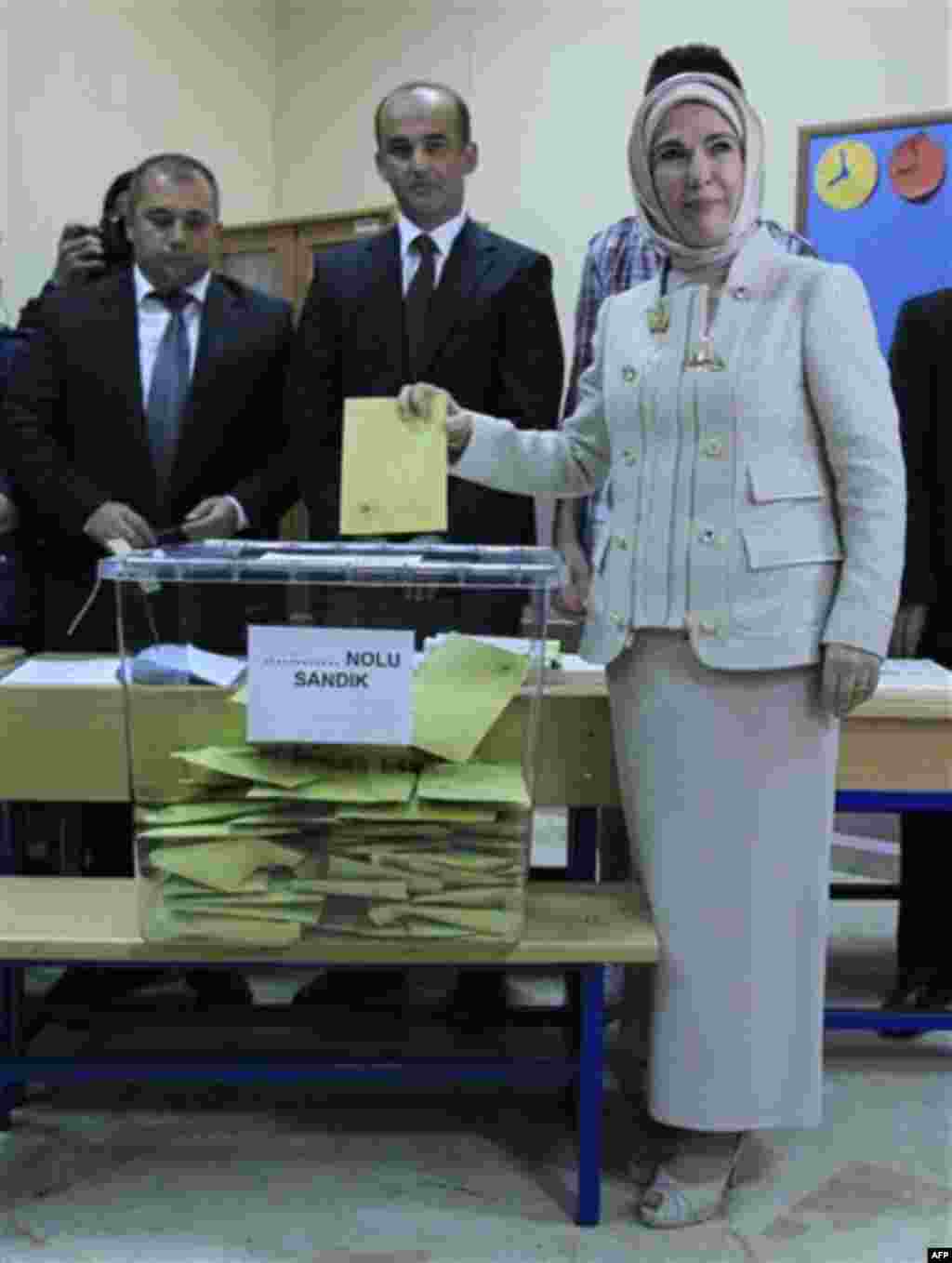 Emine Erdogan wife of Turkish Prime Minister Recep Tayyip Erdogan casts her ballot at a polling station in Istanbul, Sunday, June 12, 2011. About 52 million Turks vote In Sunday's general elections. Turkey's ruling party sought a third term in elections S