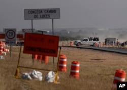 Workers leave the Ford construction site after they were sent home early the day after the U.S. auto company cancelled plans to build its plant in Villa de Reyes, Mexico, Jan. 4, 2017..