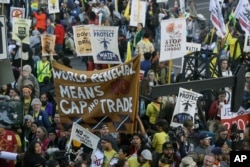 Protesters block an entrance to the Moscone Center where the Global Action Climate Summit was taking place, Sept. 13, 2018, in San Francisco.