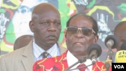 Zimbabwe President Robert Mugabe addressing members of his Zanu PF party at a football stadium in Lupane, about 600km south west of Zimbabwe's capital (S. Mhofu/VOA)