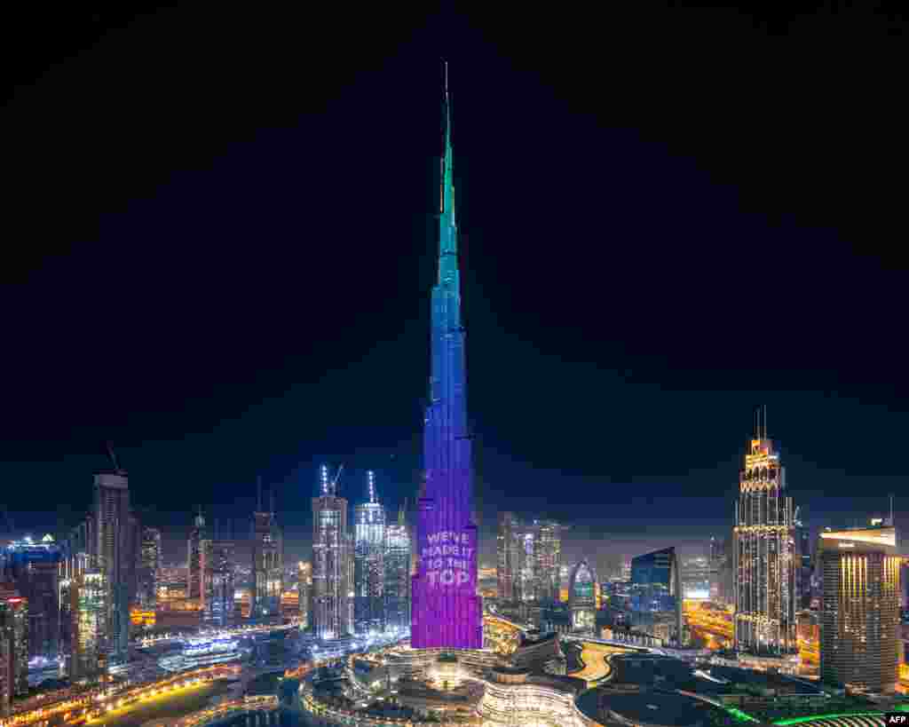 A handout image made available by the Mohammed Bin Rashid Al Maktoum Global Initiatives (MBRGI) shows Burj Khalifa during a light show to mark &quot;10 million meals&quot; Covid-19 campaign.