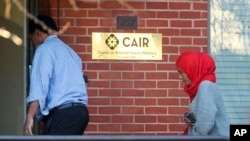 People enter the headquarters of Council on American-Islamic Relations (CAIR) in Washington, Dec. 10, 2015. CAIR helped Shaima Swileh, a Muslim in Yemen, win a legal battle that will allow her to see her son, who is on life support in San Francisco.