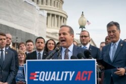 Rep. David Cicilline, D-R.I., joined at right by Chad Griffin, president of the Human Rights Campaign, and Rep. Mark Takano, D-Calif., speaks before a House vote on the Equality Act of 2019, which would extend anti-discrimination protections to LGBT Ameri