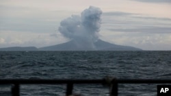 FILE - Mount Anak Krakatau spews volcanic material during an eruption as seen from an Indonesian Navy ship in the waters of Sunda Strait, Dec. 28, 2018.