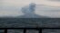 FILE - Mount Anak Krakatau spews volcanic material during an eruption as seen from an Indonesian Navy ship in the waters of Sunda Strait, Dec. 28, 2018.