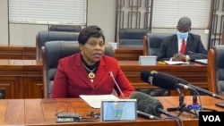 FILE - Monica Mutsvangwa, Zimbabwe’s information minister, talks to reporters in Harare, July 06, 2021. Mutsvangwa says a recent spike in COVID-19 cases has forced authorities to ask all government workers to be vaccinated. (Columbus Mavhunga/VOA)