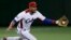 FILE - Cuba's third baseman Yulieski Gurriel catches the ball in the first inning at the World Baseball Classic (WBC) second round game in Tokyo, March 9, 2013.