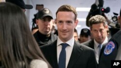 Facebook CEO Mark Zuckerberg arrives on Capitol Hill in Washington, April 9, 2018, to meet with Sen. Dianne Feinstein, D-Calif., the ranking member of the Senate Judiciary Committee. 