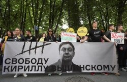 Participants rally in support of Kirill Vyshinsky, director of the Ukrainian office of the Russian state news agency RIA Novosti, who was detained on treason charges in 2018, outside the Ukrainian embassy in Moscow, Russia, May 15, 2019.