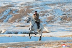 North Korean leader Kim Jong Un rides a horse during snowfall in Mount Paektu in this image released by North Korea's Korean Central News Agency.