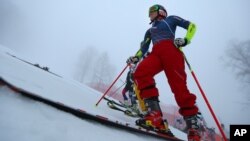 United States' Mikaela Shiffrin stands on the alpine skiing training slopes at the Sochi 2014 Winter Olympics, Feb. 17, 2014, in Krasnaya Polyana, Russia.