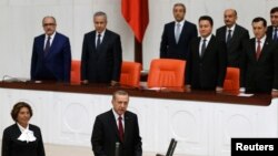 Turkey's new President Tayyip Erdogan (front C) attends a swearing in ceremony at the parliament in Ankara, August 28, 2014.
