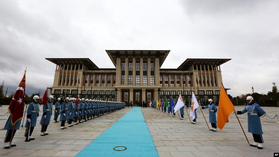 Military honor guards stand ready outside the new presidential palace complex in Ankara, Turkey, Dec. 1, 2014. 