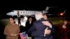 Freed US nationals Emad Shargi (C R) greets a family member as he and 4 others, who were released in a prisoner swap deal between US and Iran, disembark from an airplane at Davison Army Airfield at Fort Belvoir, Virginia, on September 19, 2023.