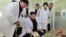 FILE - North Korean leader Kim Jong Un (C) provides field guidance at Kumkop General Foodstuff Factory for Sportspersons in this undated photo released by North Korea's Korean Central News Agency (KCNA) in Pyongyang, Jan. 8, 2015. 