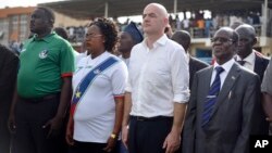 FIFA's new president, Gianni Infantino, at center-right, stands with South Sudan's Vice President James Wani Igga, right, before a match between South Sudan and Benin, in Juba, March 23, 2016. Infantino came to help open the South Sudan Football Association at a time when the young country's government is struggling for funds due to a drop in worldwide oil prices and an expensive civil war that is in its third year. 