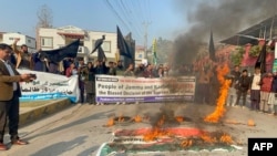 Pasban-e-Hurriyat Jammu and Kashmir activists shout slogans in Pakistan, on Dec.11, 2023, as they protest against India's Supreme Court decision on the special status of Kashmir.