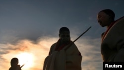 FILE - Youths take part in an initiation ceremony marking their transition from boyhood to manhood in the Eastern Cape, South Africa, July 10, 2006.