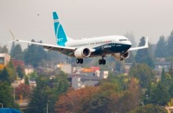 A Boeing 737 Max lands at Boeing Field in Seattle, Sept. 30, 2020.