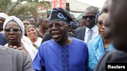 Presidential candidate Bola Ahmed Tinubu arrives at a polling station before casting his ballot in Ikeja, Lagos,February 25, 2023 