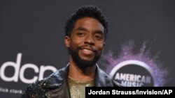 FILE - Chadwick Boseman poses in the press room at the American Music Awards on Nov. 24, 2019, at the Microsoft Theater in Los Angeles. 